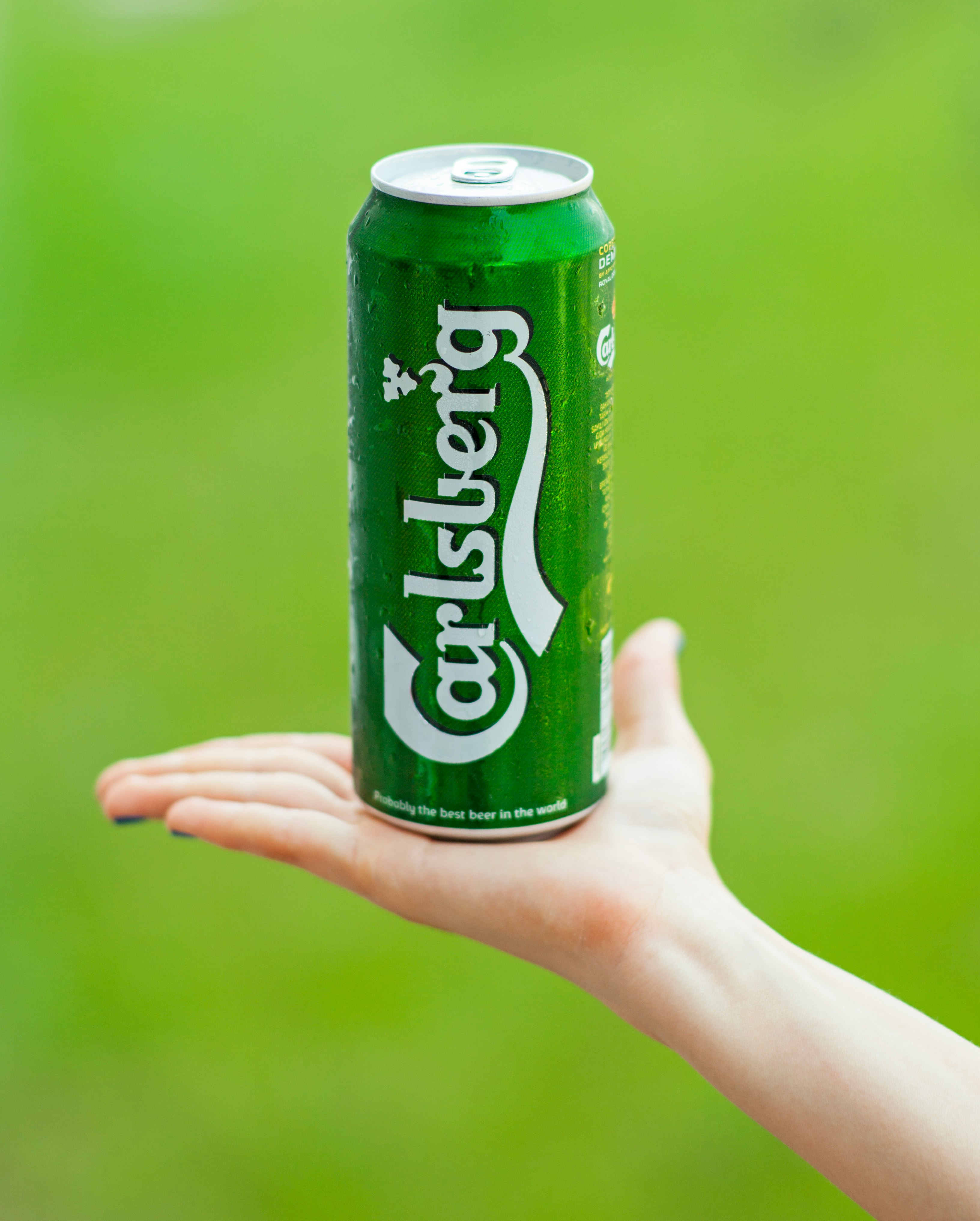 person holding sprite soda can